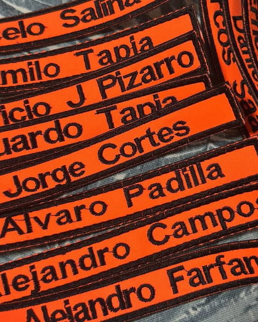 Cintas de nombre bordadas en tela naranja de alta visibilidad